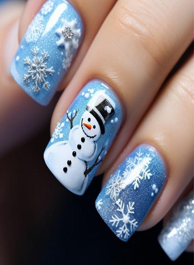 OCOUYVD Christmas Press on Nails Short Square Blue Glitter Fake Nails with Snowflake ＆ Snowman Designs Cute Xmas Winter Acrylic Nails Full Cover False Nails Stick on Nails for Women Women Nail Art DIY 24 Pcs - Image 1